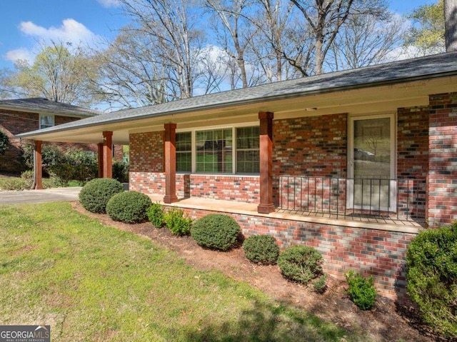 1505 Robinhood Trl, Gainesville, GA 30501 - view of property exterior with a porch, brick siding, and a lawn