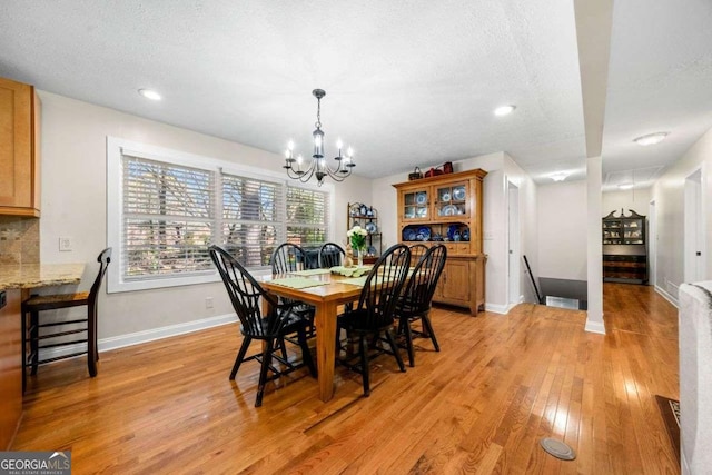 1505 Robinhood Trl, Gainesville, GA 30501 - dining area with a chandelier, light wood-type flooring, recessed lighting, and a textured ceiling