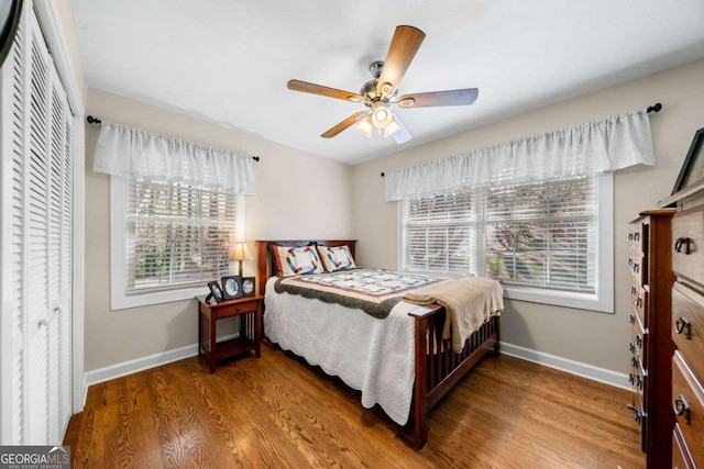 1505 Robinhood Trl, Gainesville, GA 30501 - bedroom with wood finished floors, ceiling fan, and a closet