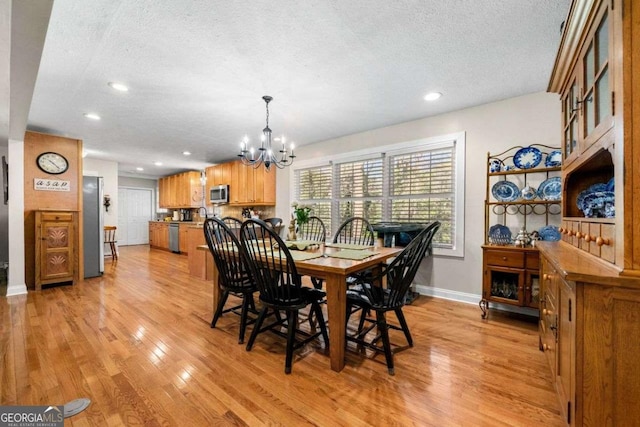 1505 Robinhood Trl, Gainesville, GA 30501 - dining room featuring a textured ceiling, a chandelier, light wood-type flooring, and recessed lighting