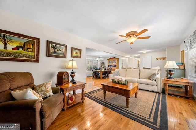 1505 Robinhood Trl, Gainesville, GA 30501 - living area with ceiling fan, wood-type flooring, and a chandelier