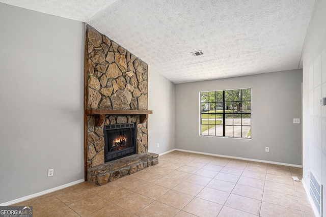 910 Brandon Hill Way, Jonesboro, GA 30238 - unfurnished living room with a textured ceiling, a fireplace, and tile patterned floors