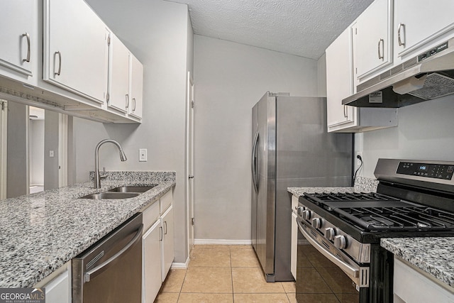 910 Brandon Hill Way, Jonesboro, GA 30238 - kitchen with appliances with stainless steel finishes, a sink, under cabinet range hood, white cabinets, and light tile patterned floors