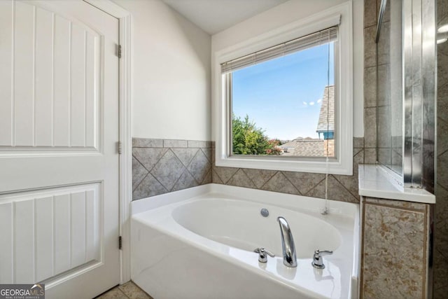 bathroom featuring a garden tub