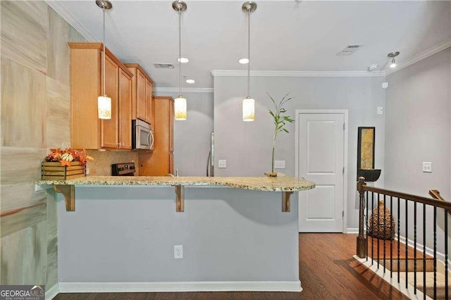 kitchen featuring visible vents, light stone counters, crown molding, and appliances with stainless steel finishes