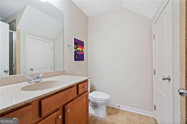 full bath featuring baseboards, toilet, vanity, a shower with door, and vaulted ceiling