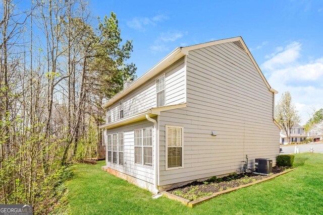 3543 Benthollow Way, Duluth, GA 30096 - view of home's exterior featuring cooling unit and a lawn