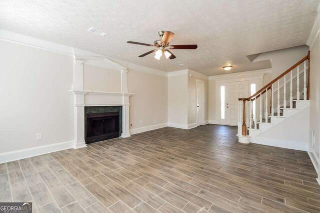 3543 Benthollow Way, Duluth, GA 30096 - unfurnished living room with visible vents, stairs, a fireplace, ceiling fan, and wood finish floors
