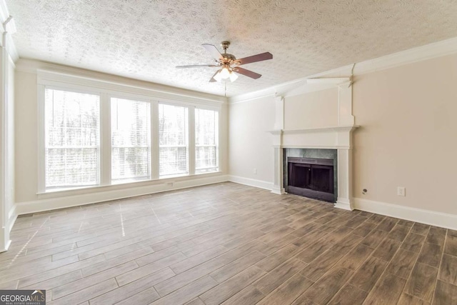 3543 Benthollow Way, Duluth, GA 30096 - unfurnished living room with a ceiling fan, a textured ceiling, a fireplace, and wood finished floors
