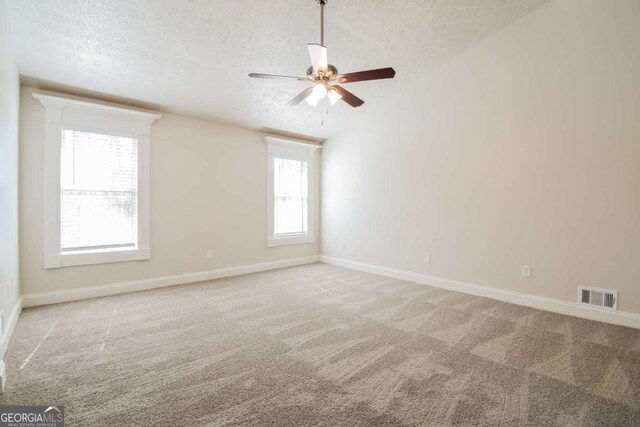 3543 Benthollow Way, Duluth, GA 30096 - unfurnished room featuring light colored carpet, baseboards, a textured ceiling, visible vents, and a ceiling fan