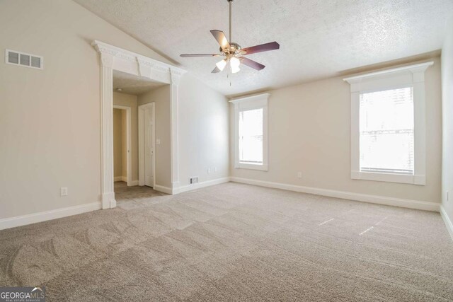 3543 Benthollow Way, Duluth, GA 30096 - carpeted spare room with visible vents, ceiling fan, lofted ceiling, and a textured ceiling