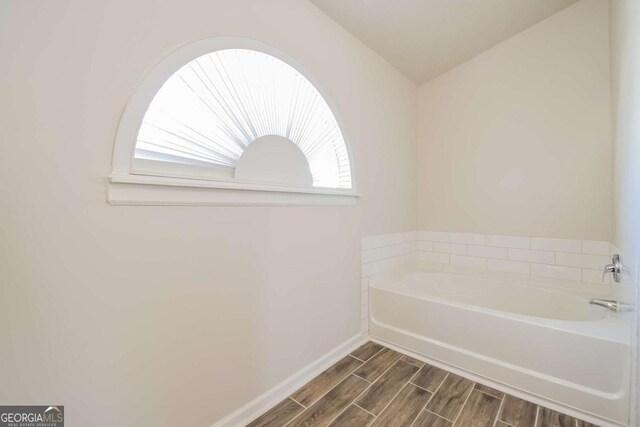 3543 Benthollow Way, Duluth, GA 30096 - full bath with a bath, baseboards, and wood finish floors