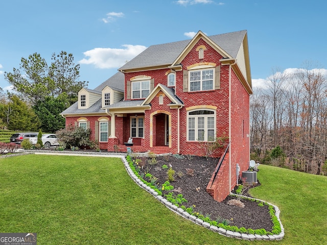 2220 Stirling Bridge Rd, Cumming, GA 30041 - view of front of property featuring cooling unit, brick siding, and a front lawn