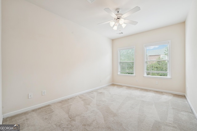2220 Stirling Bridge Rd, Cumming, GA 30041 - carpeted spare room featuring baseboards, visible vents, and a ceiling fan