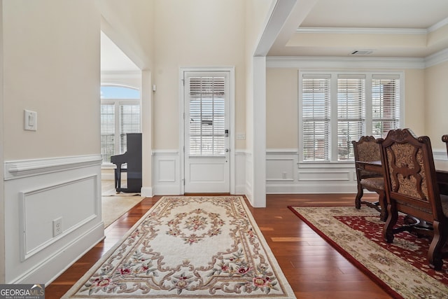 2220 Stirling Bridge Rd, Cumming, GA 30041 - foyer featuring visible vents, ornamental molding, a raised ceiling, dark wood-style floors, and wainscoting