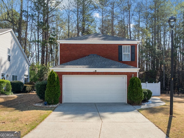 3465 Maple Valley Dr, Cumming, GA 30040 - view of side of home with brick siding, concrete driveway, roof with shingles, and an attached garage