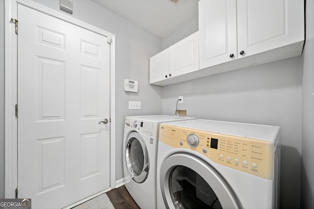 3465 Maple Valley Dr, Cumming, GA 30040 - washroom featuring washer and dryer, cabinet space, and dark wood-style flooring