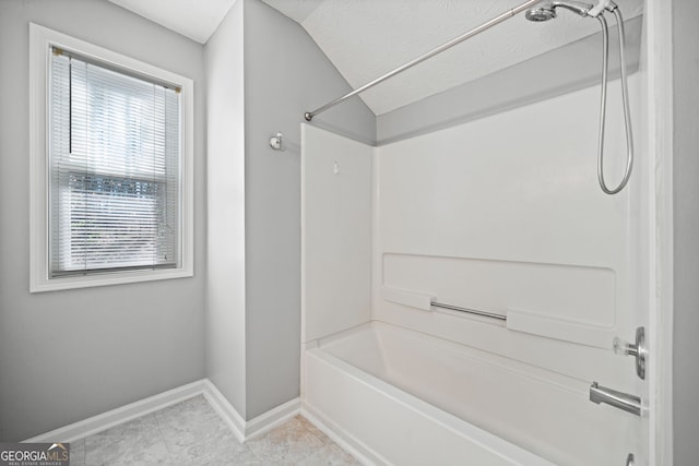 3465 Maple Valley Dr, Cumming, GA 30040 - bathroom featuring washtub / shower combination, vaulted ceiling, and tile patterned flooring