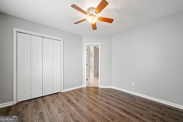 3465 Maple Valley Dr, Cumming, GA 30040 - unfurnished bedroom with dark wood-style flooring, a closet, and a ceiling fan
