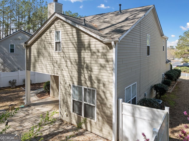 3465 Maple Valley Dr, Cumming, GA 30040 - back of property with a chimney and a patio area