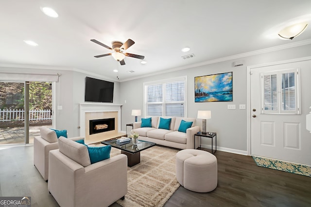 3465 Maple Valley Dr, Cumming, GA 30040 - living area featuring wood finished floors, a ceiling fan, recessed lighting, a fireplace with flush hearth, and crown molding