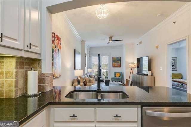 kitchen with a sink, open floor plan, ornamental molding, and dishwasher