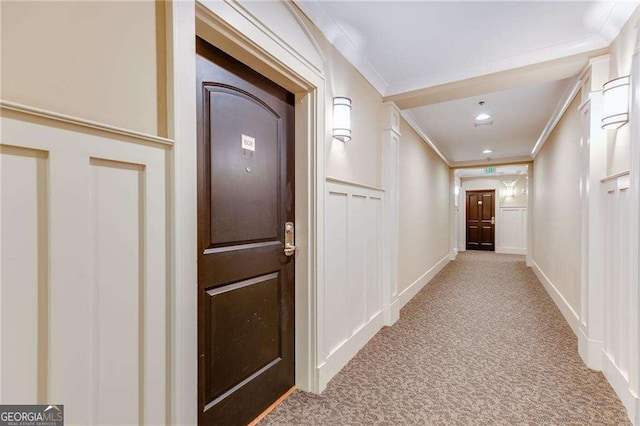 2277 Peachtree Rd NE Unit 608, Atlanta, GA 30309 - hall with carpet floors, crown molding, and a decorative wall