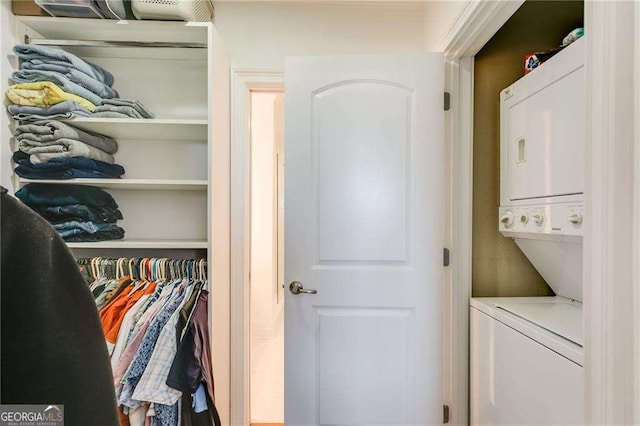 closet with stacked washer and dryer