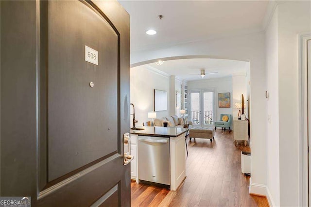 2277 Peachtree Rd NE Unit 608, Atlanta, GA 30309 - corridor featuring crown molding, arched walkways, french doors, wood finished floors, and recessed lighting