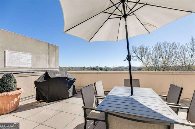 view of patio / terrace with a grill and outdoor dining space