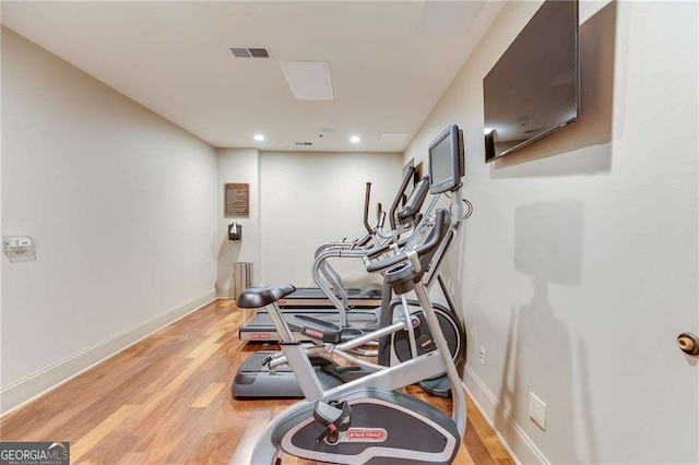 2277 Peachtree Rd NE Unit 608, Atlanta, GA 30309 - exercise room with light wood-style flooring and recessed lighting
