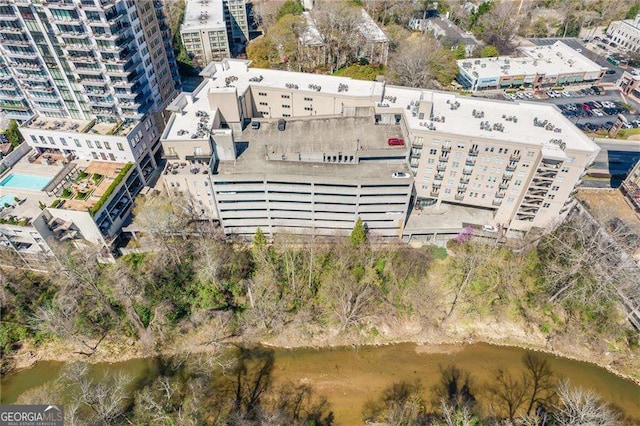 drone / aerial view featuring a water view and a view of city