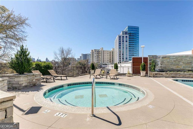 2277 Peachtree Rd NE Unit 608, Atlanta, GA 30309 - view of pool with a patio area and a city view