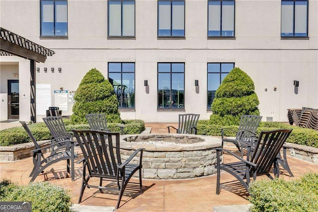 2277 Peachtree Rd NE Unit 608, Atlanta, GA 30309 - view of patio / terrace with a fire pit