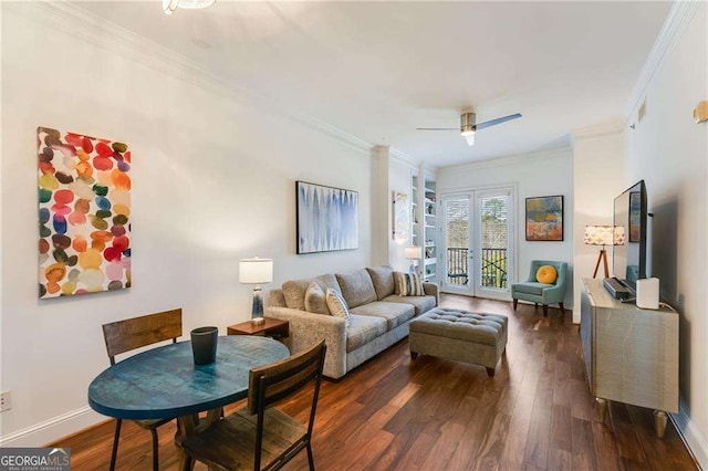 living area with baseboards, ceiling fan, ornamental molding, and dark wood-style flooring