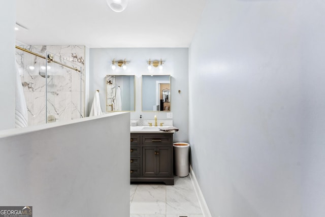 full bathroom with marble finish floor, baseboards, vanity, and a marble finish shower