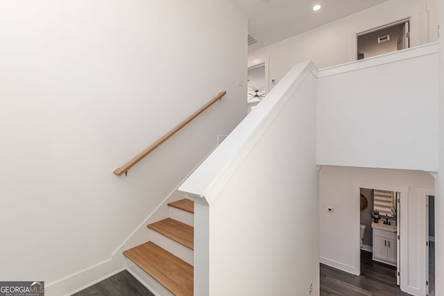 staircase with baseboards, wood finished floors, recessed lighting, and a ceiling fan