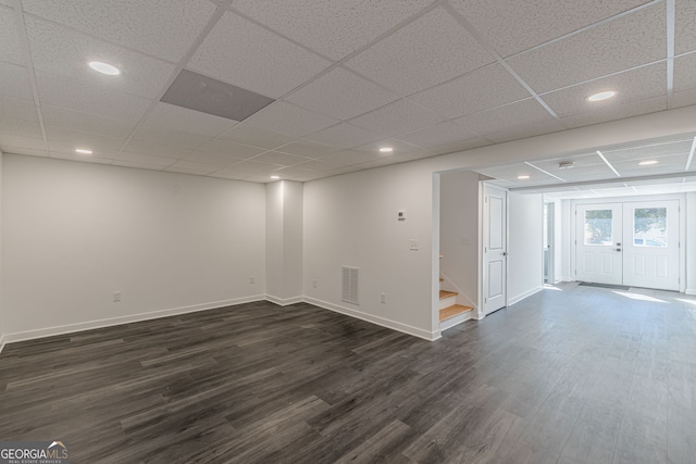 basement with stairway, dark wood finished floors, baseboards, visible vents, and recessed lighting