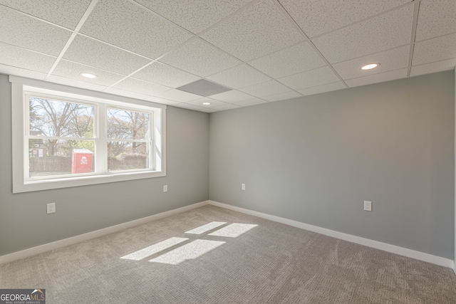 spare room featuring baseboards, recessed lighting, and carpet