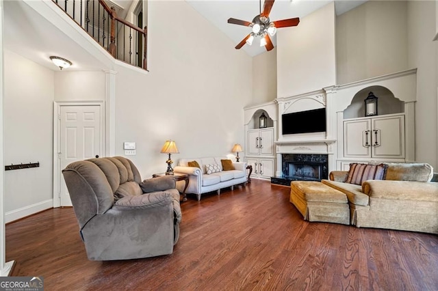 3795 Duckcove Way, Cumming, GA 30041 - living room with high vaulted ceiling, a ceiling fan, wood finished floors, a high end fireplace, and baseboards