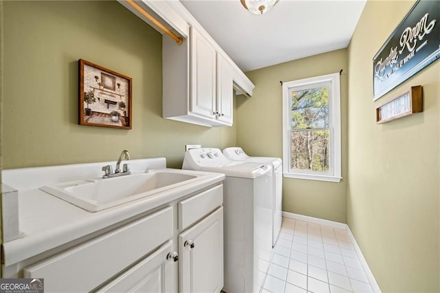 3795 Duckcove Way, Cumming, GA 30041 - laundry room featuring cabinet space, washing machine and clothes dryer, light tile patterned floors, and baseboards