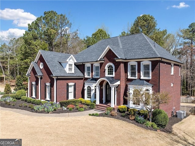 3795 Duckcove Way, Cumming, GA 30041 - colonial home with brick siding, cooling unit, and roof with shingles