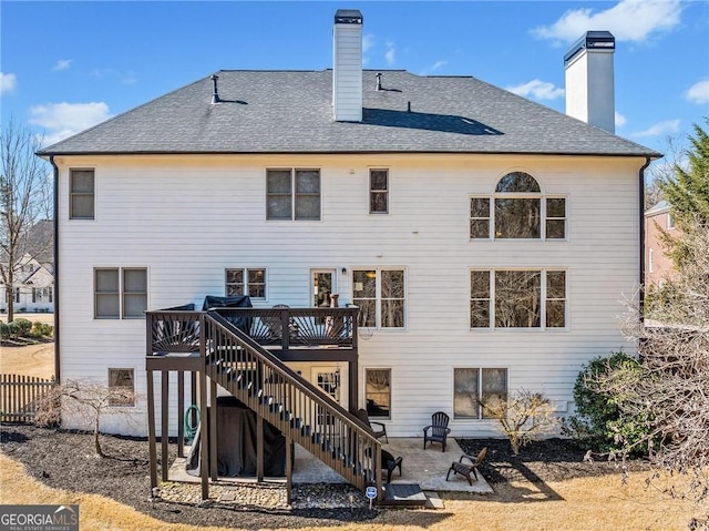 3795 Duckcove Way, Cumming, GA 30041 - back of house with stairs, a chimney, a wooden deck, and a patio