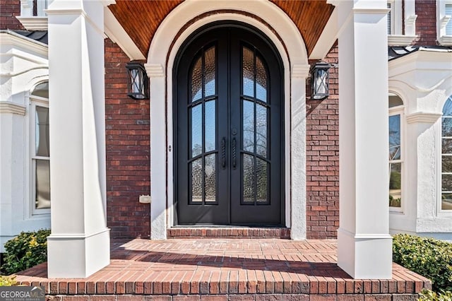 3795 Duckcove Way, Cumming, GA 30041 - doorway to property featuring french doors, brick siding, and covered porch