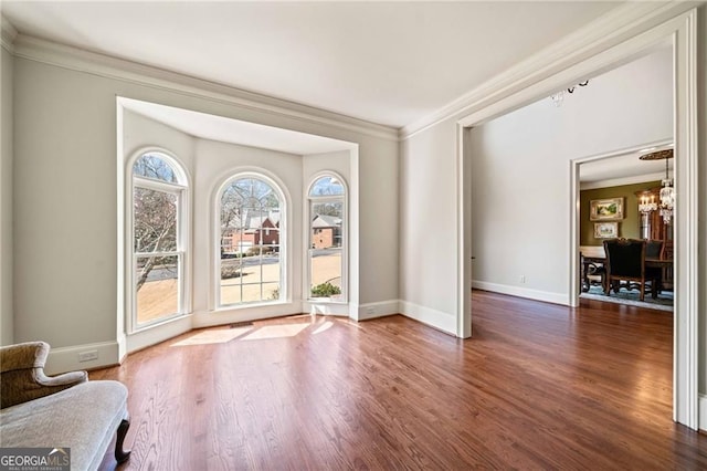 3795 Duckcove Way, Cumming, GA 30041 - entrance foyer with crown molding, wood finished floors, baseboards, and a chandelier