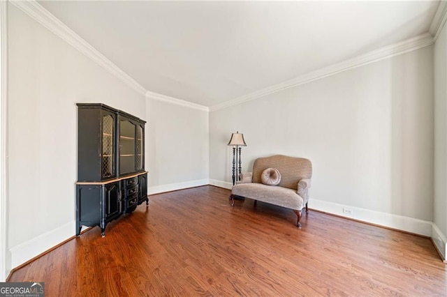 3795 Duckcove Way, Cumming, GA 30041 - sitting room featuring wood finished floors, crown molding, and baseboards