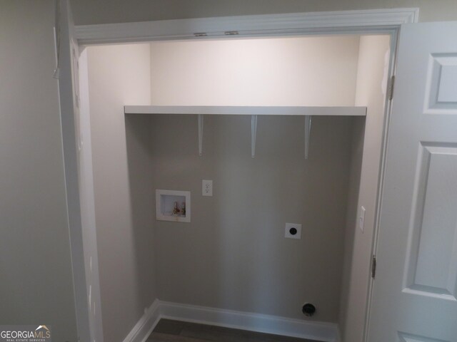 505 Palomino Ln, Warner Robins, GA 31088 - clothes washing area featuring hookup for an electric dryer, washer hookup, and baseboards