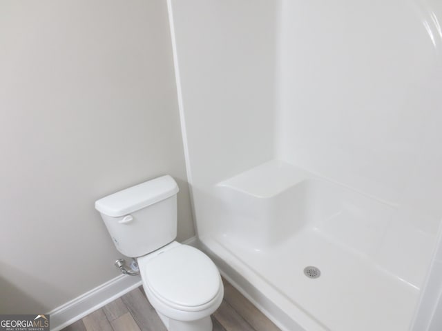 505 Palomino Ln, Warner Robins, GA 31088 - full bath with baseboards, wood finished floors, a shower, and toilet
