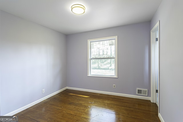 2666 Frontier Trl, Atlanta, GA 30341 - empty room with dark wood finished floors, visible vents, and baseboards