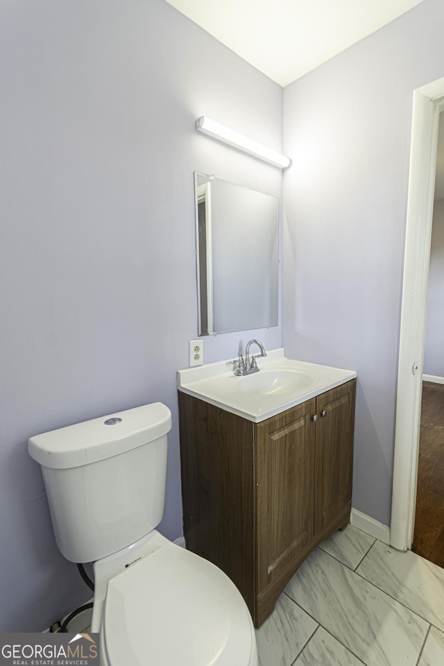 2666 Frontier Trl, Atlanta, GA 30341 - bathroom with toilet, vanity, and baseboards